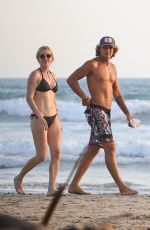 ELLIE GOULDING and Armando Perez at a Beach in Costa Rica 03/29/2024