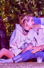 EMMA ROBERTS with Mystery Guy at Coachella 04/13/2024