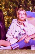 EMMA ROBERTS with Mystery Guy at Coachella 04/13/2024