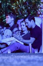 EMMA ROBERTS with Mystery Guy at Coachella 04/13/2024