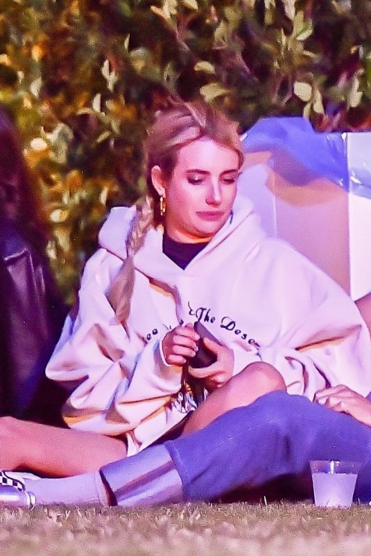 EMMA ROBERTS with Mystery Guy at Coachella 04/13/2024