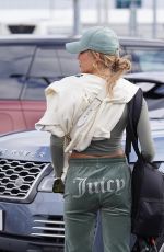GEORGIA HARRISON Shares a Kiss with Boyfriend at Edinburgh Airport 03/31/2024