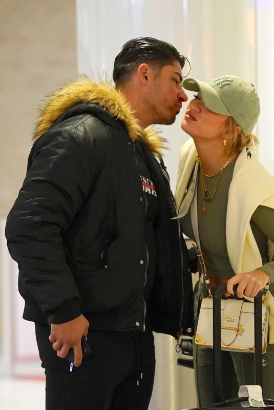GEORGIA HARRISON Shares a Kiss with Boyfriend at Edinburgh Airport 03/31/2024