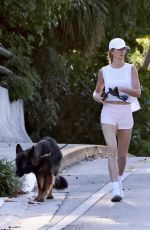 GISELE BUNDCHEN Out for a Morning Walk with Her Dog in Miami Beach 04/24/2024