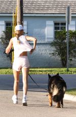 GISELE BUNDCHEN Out for a Morning Walk with Her Dog in Miami Beach 04/24/2024