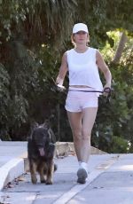 GISELE BUNDCHEN Out for a Morning Walk with Her Dog in Miami Beach 04/24/2024