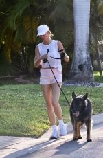 GISELE BUNDCHEN Out for a Morning Walk with Her Dog in Miami Beach 04/24/2024