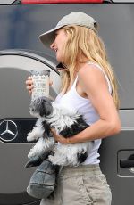 GISELE BUNDCHEN Out with Her Dogs in Miami 04/20/2024