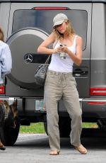 GISELE BUNDCHEN Out with Her Dogs in Miami 04/20/2024
