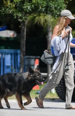 GISELE BUNDCHEN Out with Her Dogs in Miami 04/20/2024