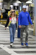 HEATHER GRAHAM and John De Neufville Arrives at Miami International Airport 03/08/2024