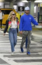 HEATHER GRAHAM and John De Neufville Arrives at Miami International Airport 03/08/2024