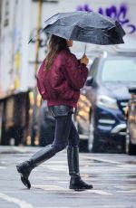 IRINA SHAYK Ourt with Her Dog Under the Rain in New York 04/03/2024