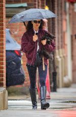 IRINA SHAYK Ourt with Her Dog Under the Rain in New York 04/03/2024