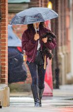 IRINA SHAYK Ourt with Her Dog Under the Rain in New York 04/03/2024