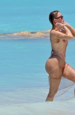 KHLOE KARDASHIAN in Swimsuit at a Beach in Turks and Caicos 04/03/2024