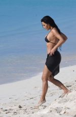 KIM KARDASHIAN in Bikini at a Beach in Turks and Caicos 04/04/2024