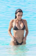 KIM KARDASHIAN in Bikini at a Beach in Turks and Caicos 04/04/2024
