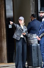 LILY JAMES Checks Out of Her Hotel in London 04/06/2024