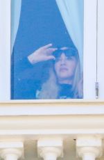 MADONNA Admires Copacabana Beach from Her Hotel Window 04/29/2024