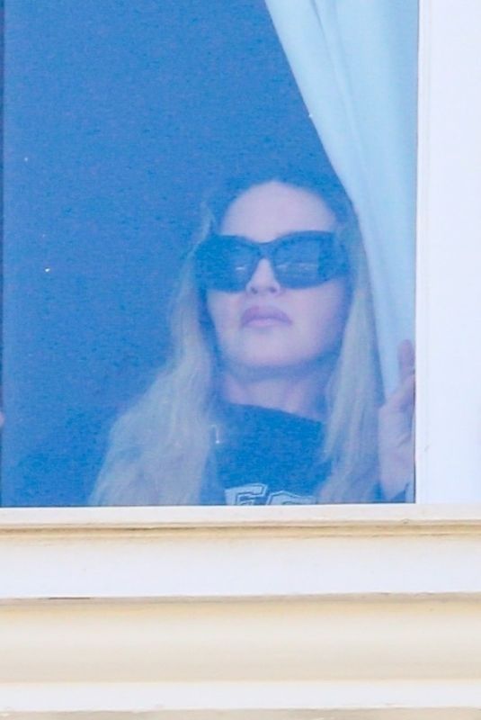 MADONNA Admires Copacabana Beach from Her Hotel Window 04/29/2024
