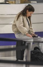 MICHELLE KEEGAN Checking in for a Flight at Sydney