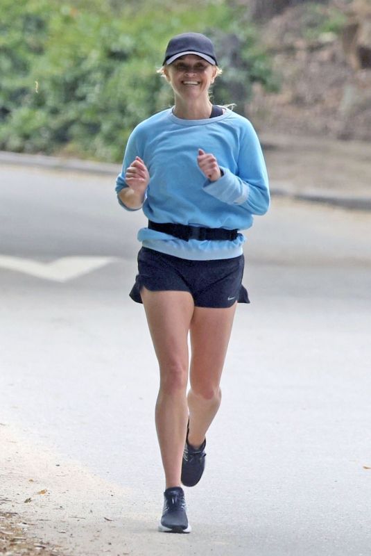 REESE WITHERSPOON Out Jogging Near Her Home in Brentwood 04/23/2024