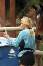 REESE WITHERSPOON Taking Selfies with Local Horses in Los Angeles 04/16/2024