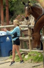 REESE WITHERSPOON Taking Selfies with Local Horses in Los Angeles 04/16/2024