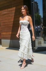 BELLA HADID in a White Strapless Lace Dress Out in New York 05/02/2024