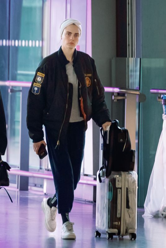 CARA DELEVINGNE Leaves Heathrow Airport 05/05/2024