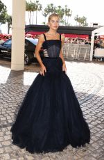 CAROLINE DAUR Leaves Hotel Martinez at 77th Cannes Film Festival 05/16/2024