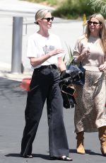 CHARLIZE THERON Leaves Netflix Building with a Friend in Los Angeles 05/08/2024