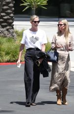 CHARLIZE THERON Leaves Netflix Building with a Friend in Los Angeles 05/08/2024