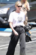 CHARLIZE THERON Leaves Netflix Building with a Friend in Los Angeles 05/08/2024