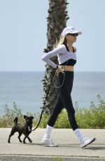 CHARLOTTE MCKINNEY Out with Her Dog at a Beach in Santa Monica 05/01/2024
