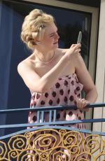 ELLA FANNING at a Photoshoot at Martinez Hotel in Cannes 05/24/2024