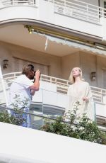 ELLE FANNING Doing a Photoshoot at Hotel Martinez in Cannes 05/25/2024