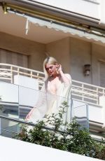 ELLE FANNING Doing a Photoshoot at Hotel Martinez in Cannes 05/25/2024