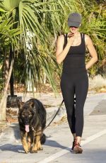 GISELE BUNDCHEN Out for Morning Walk with Her Dog in Miami 05/09/2024