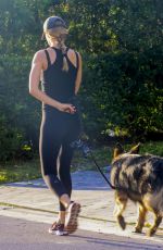 GISELE BUNDCHEN Out for Morning Walk with Her Dog in Miami 05/09/2024