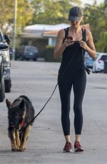GISELE BUNDCHEN Out for Morning Walk with Her Dog in Miami 05/09/2024