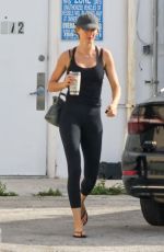 GISELE BUNDCHEN Out for Morning Walk with Her Dog in Miami 05/09/2024