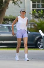 GISELE BUNDCHEN Takes a Walk with Her Dog in Miami Beach 05/16/2024