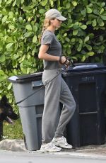 GISELE BUNDCHEN Walks Her Dog Near Her Home in Surfside 05/08/2024