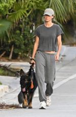 GISELE BUNDCHEN Walks Her Dog Near Her Home in Surfside 05/08/2024