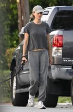 GISELE BUNDCHEN Walks Her Dog Near Her Home in Surfside 05/08/2024