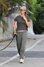 GISELE BUNDCHEN Walks Her Dog Near Her Home in Surfside 05/08/2024