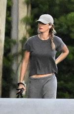 GISELE BUNDCHEN Walks Her Dog Near Her Home in Surfside 05/08/2024