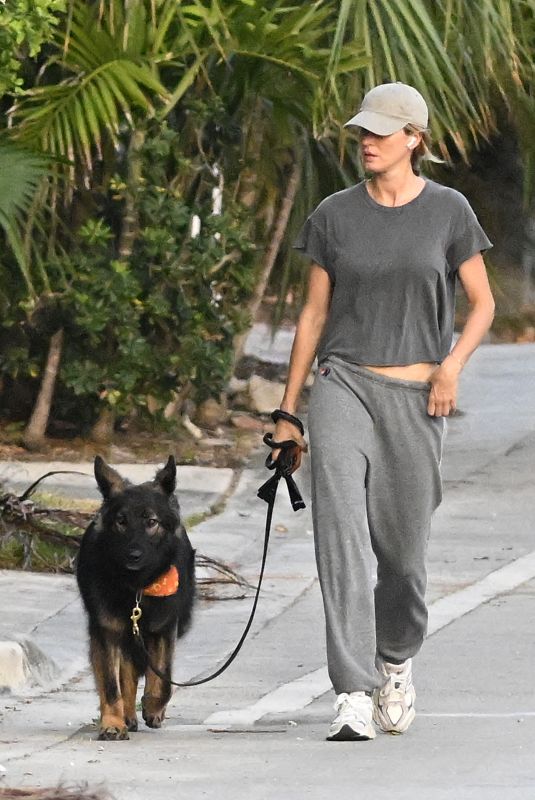 GISELE BUNDCHEN Walks Her Dog Near Her Home in Surfside 05/08/2024
